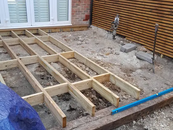 Treated timber joists levelled and framed out, ready for hardwood decking boards